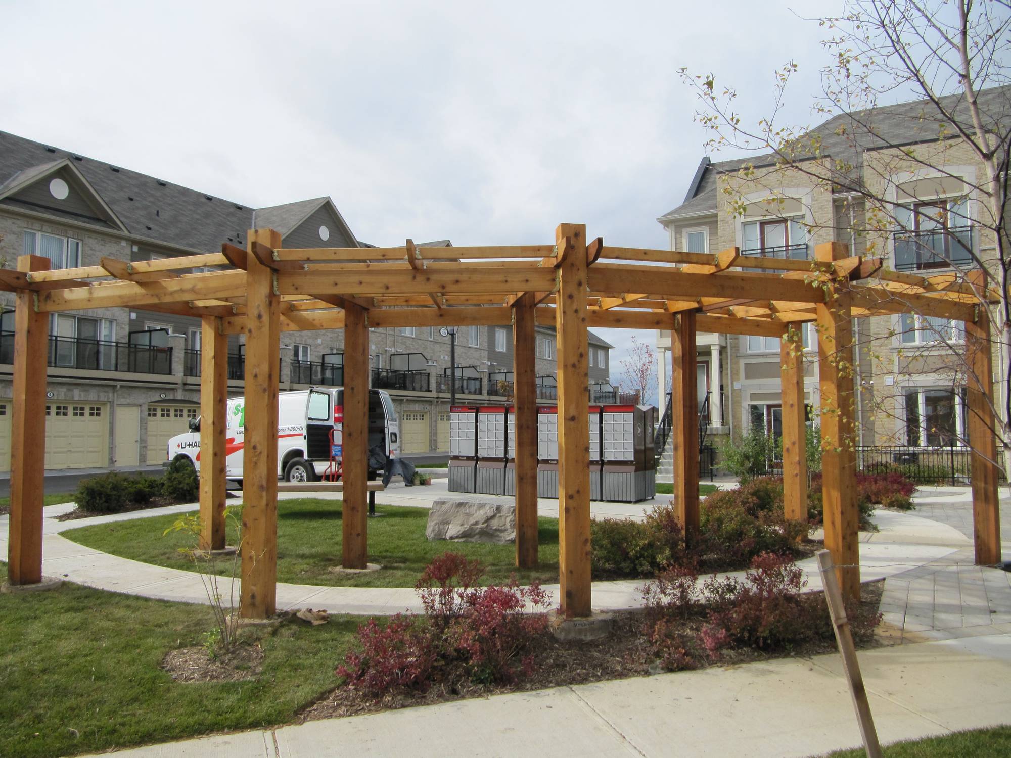 Stained wooden pergola and deck in Toronto showing even color and sealed surface.